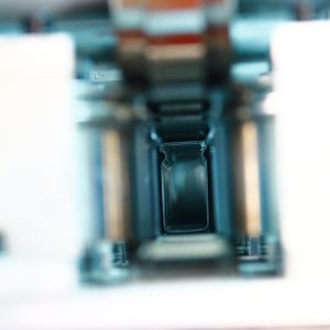 Sealed beam roll forming machine